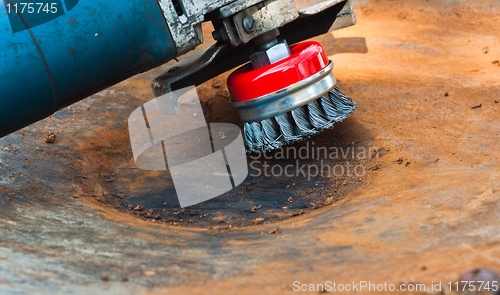 Image of wire brush for cleaning rust off metal surface