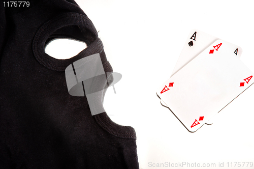 Image of A pair of aces with a mask of a burglar