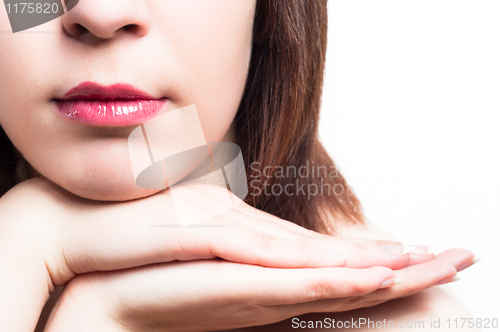 Image of Lips of a girl with her hands