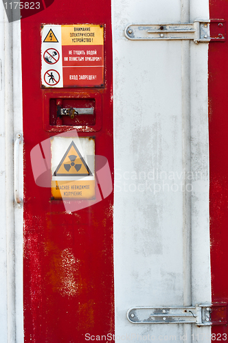 Image of Closed Door of a nuclear facility with signs on it