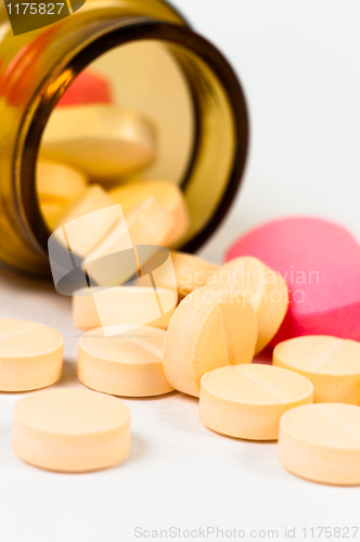 Image of A bottle of pills on white isolated background