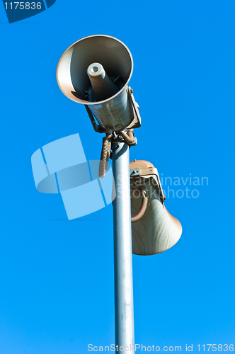 Image of loudspeaker against blue sky