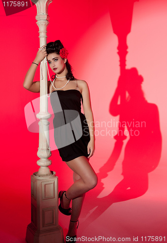 Image of young woman and lightpole
