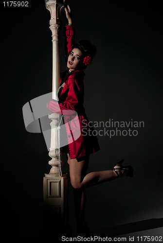Image of young woman and lightpole