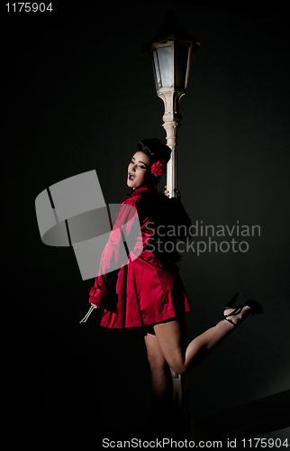 Image of young woman and lightpole