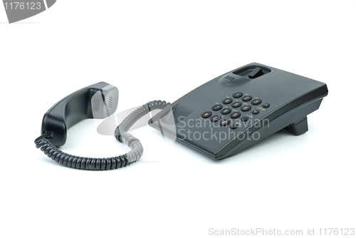 Image of Black office phone with handset near