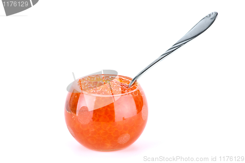 Image of Glass bowl filled with red salmon caviar and small metal spoon