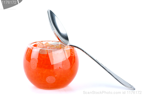 Image of Glass bowl filled with red salmon caviar and small  spoon