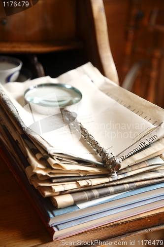 Image of Magnifying Glass on papers