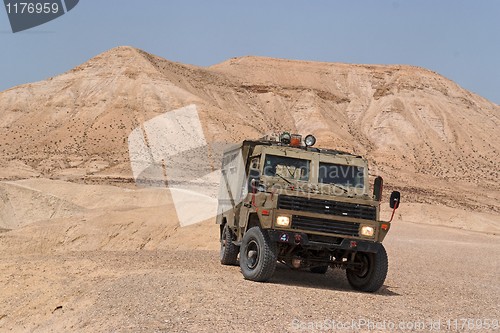 Image of Israeli army Humvee on patrol in the Judean desert 