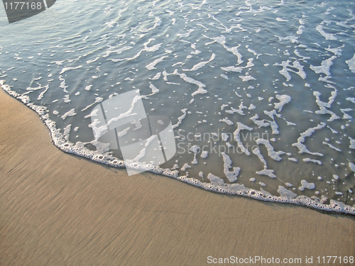 Image of wave on sand