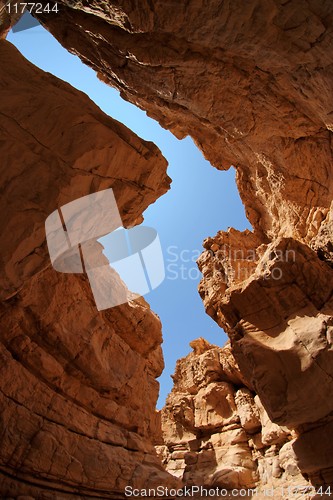 Image of Narrow slot between two rocks in desert canyon