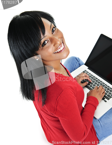Image of Young black woman using laptop computer