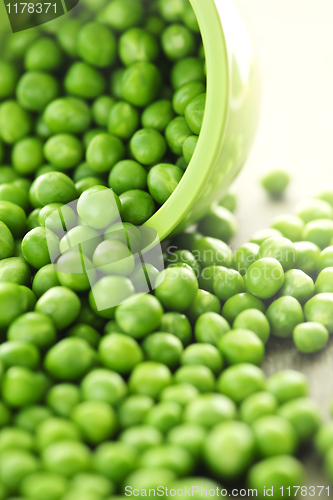 Image of Spilled bowl of green peas