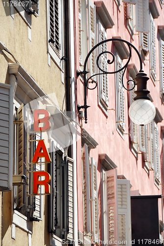 Image of Street lamp and bar sign