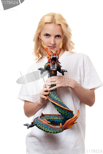 Image of beautiful girl with a wooden dragon