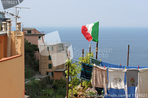 Image of Flag upon laundry hung on to dry, Corniglia.