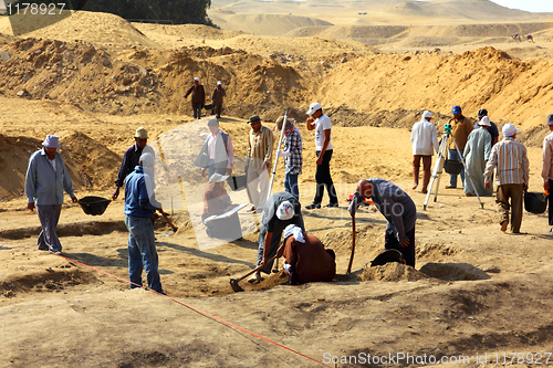 Image of archaeological digging near statue of Sphinx in Egypt