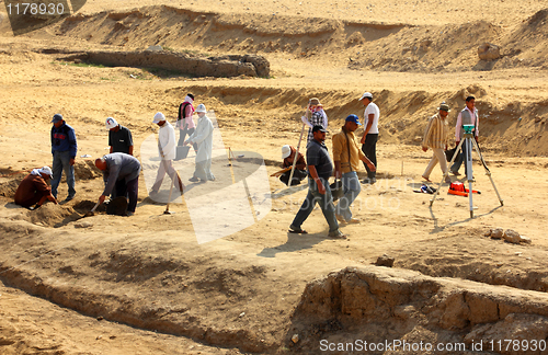 Image of archaeological digging near statue of Sphinx in Egypt