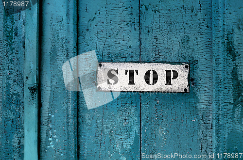 Image of a sign saying ''stop''on the grunge wooden background