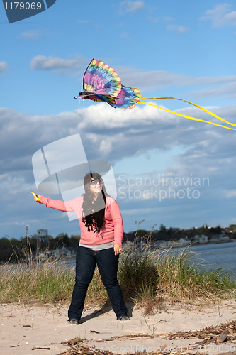 Image of Girl Flying a Kite at the Beach