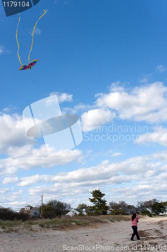 Image of Girl Flying a Kite at the Beach