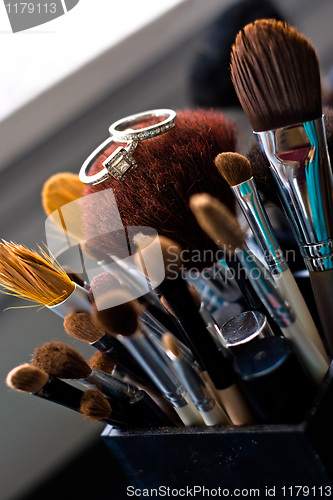 Image of Wedding Rings On Makeup Brushes