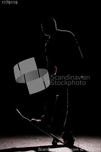 Image of Rim Lit Skateboarder Silhouette