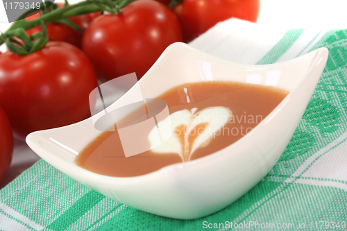 Image of tomato soup with dollop of cream