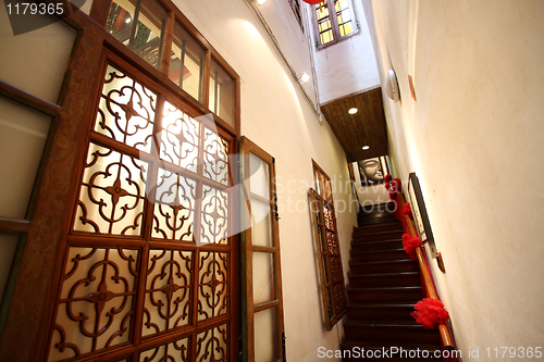 Image of Chinese traditional corridor in wooden with red lantern.