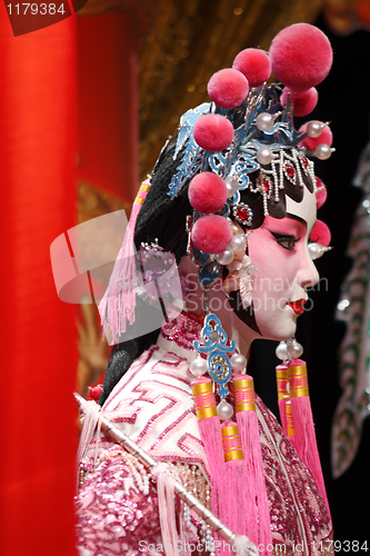 Image of chinese opera dummy and red cloth as text space ,it is a toy,not