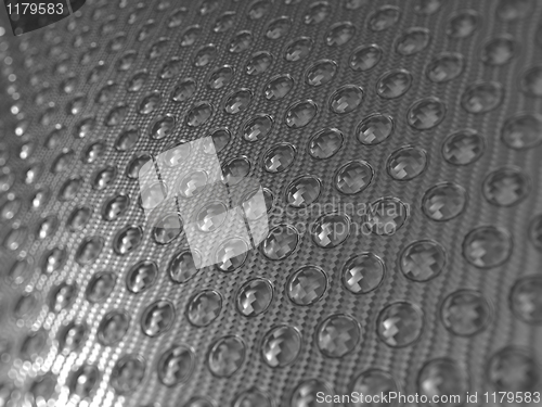 Image of Carbon fibre surface with round shapes pattern