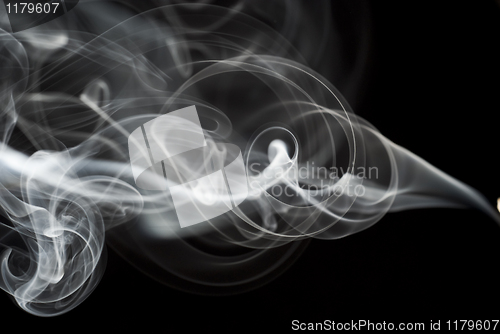 Image of Abstract black smoke swirls on black
