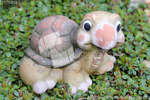 Image of Decorative turtle figurine in garden