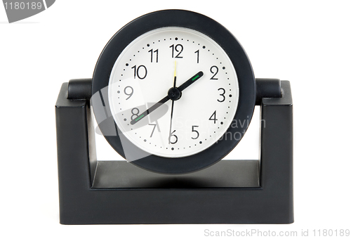 Image of Desktops mechanical clock in a black plastic casing