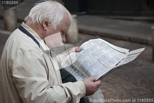 Image of Man reading his newspaper