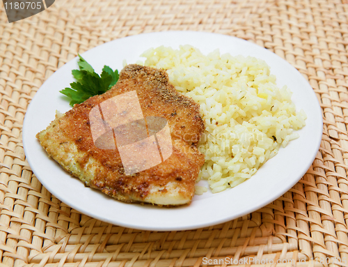 Image of fried breaded tilapia served with rice and herbs
