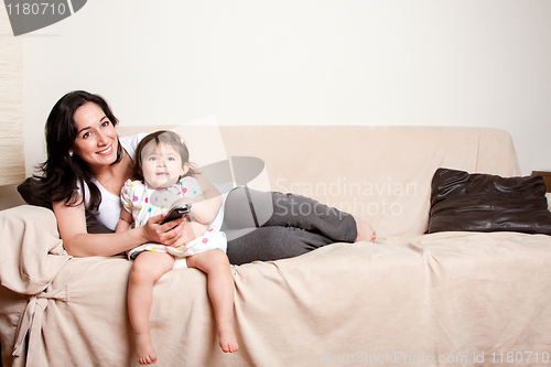 Image of Mother and daughter watching TV