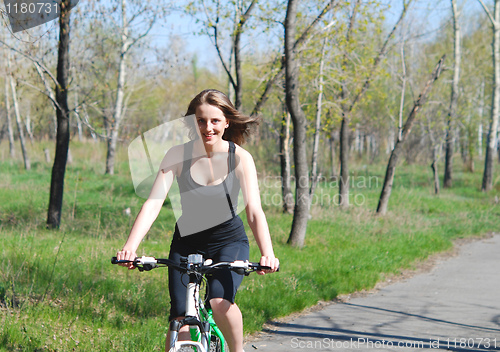 Image of biking woman