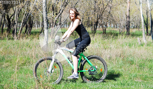 Image of biking woman