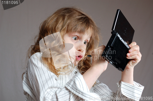 Image of child playing video game 
