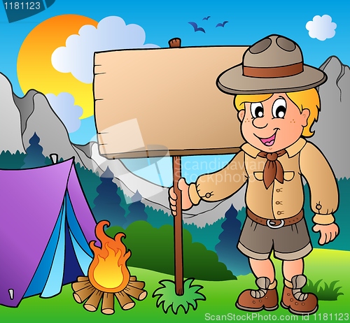 Image of Scout boy holding board outdoor