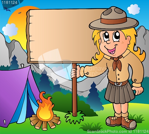 Image of Scout girl holding board outdoor