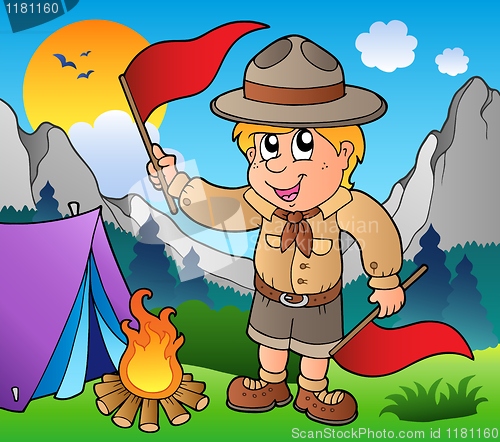 Image of Scout boy with flags outdoor