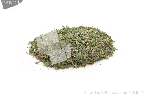 Image of Pile of dried basil spice isolated
