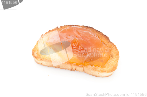 Image of apricot jam over toast isolated