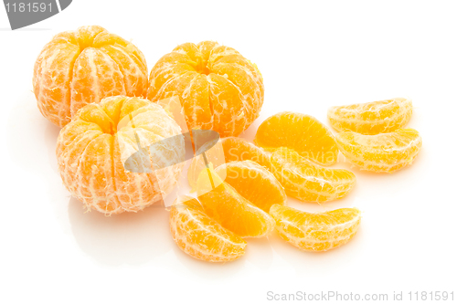 Image of lices of peeled orange on white