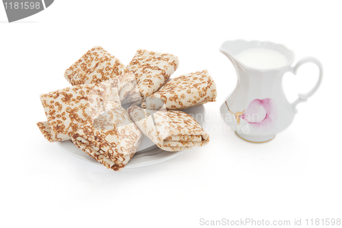 Image of Milk and Pancakes. isolated on a white