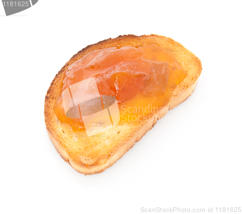 Image of apricot jam over toast isolated