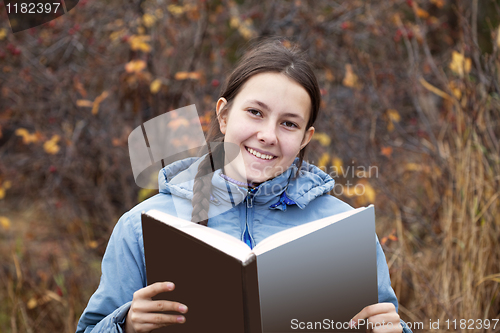 Image of Young girl with a book